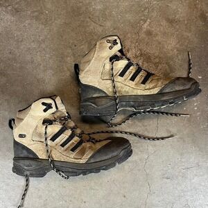 Tan and black Adidas hiking boots